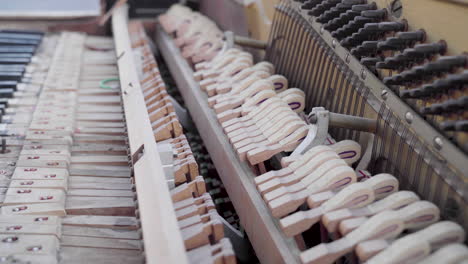 Closeup-of-an-Ancient-Broken-Piano-being-Played-and-the-Hammers-Hitting-Strings