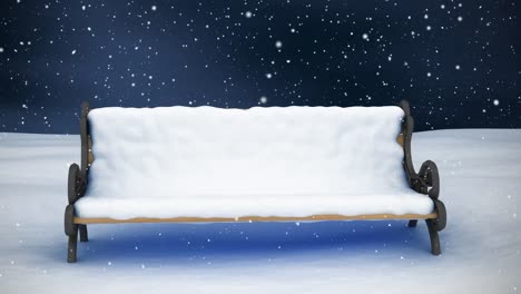 Bench-in-winter-scenery-and-falling-snow