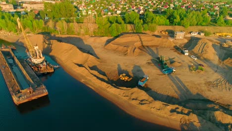 sand mining and transport on riverbank