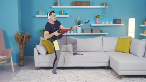 the man is cleaning his house, and suddenly he immerses himself in music, thinks of the broom in his hand like a guitar, and starts to make funny moves.