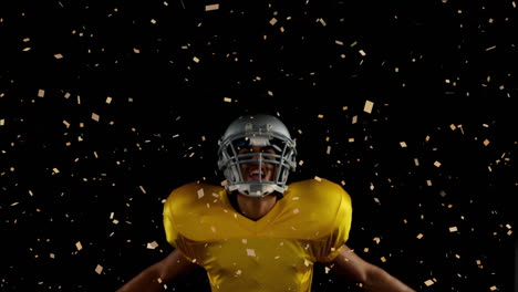 celebrating with confetti, football player in yellow jersey on field