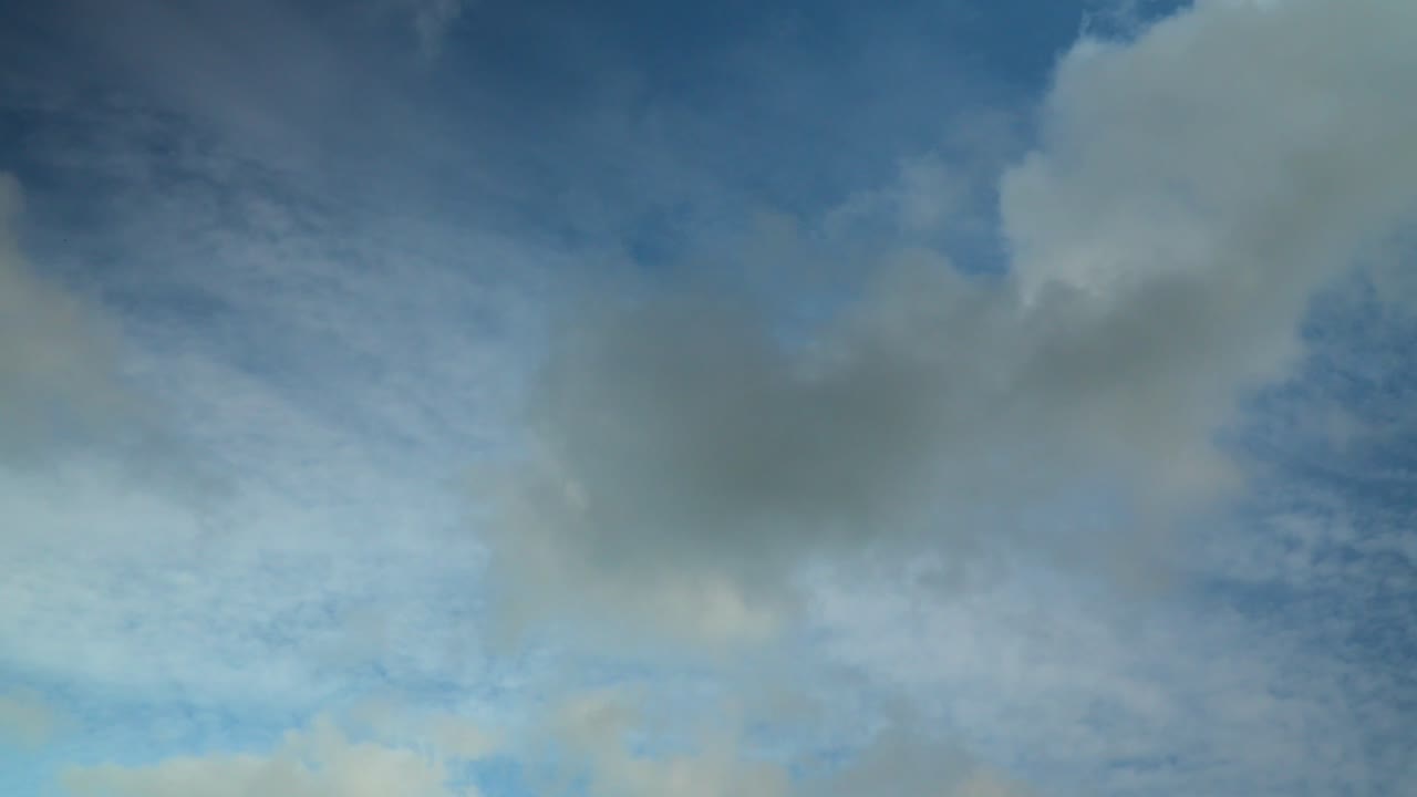 Cumulus Clouds Moving In Different Direction To Upper Cloud Layer Of Altocumulus Clouds. Summer, England. Time Lapse 60X