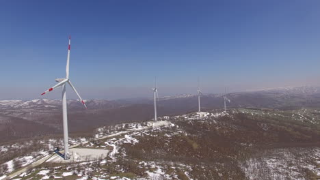 many wind turbines on top of a mountain