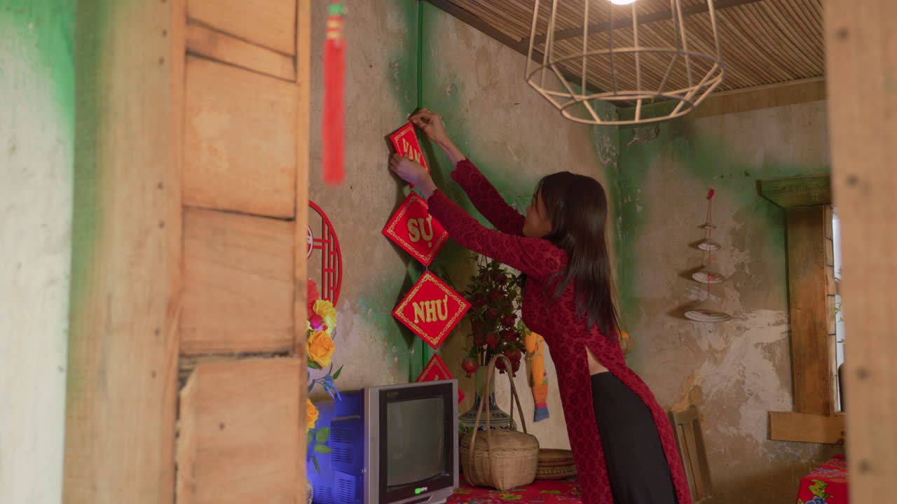 Chinese New Year celebration , housewife preparing the house with decoration slow motion holiday family gathering