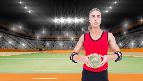 animation of caucasian female handball player holding ball over sports stadium