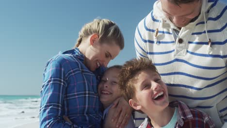 Family-enjoying-free-time-on-the-beach-together