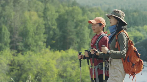 two asian female tourists enjoying summer hike