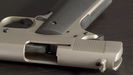 Open-and-empty-pistol,-tilting-from-grip-to-chamber