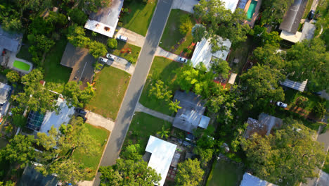 top down view over a suburban neighborhood in tampa, fl and cars driving through