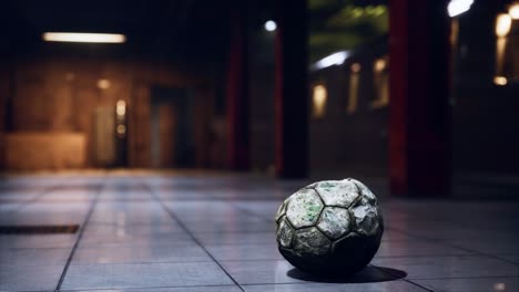 old soccer ball in empty subway
