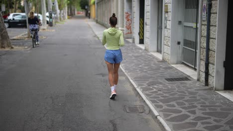 woman running in city street