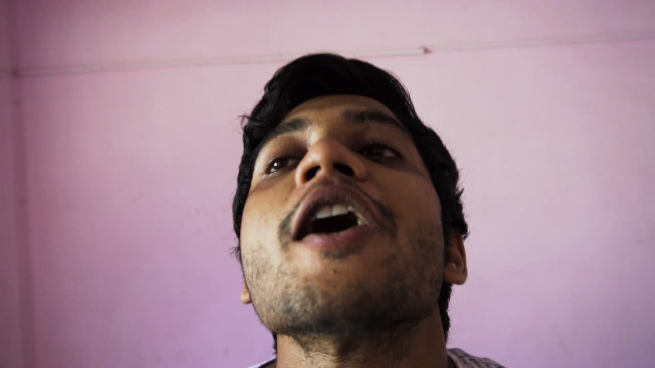 Man trying to catch grape in the air