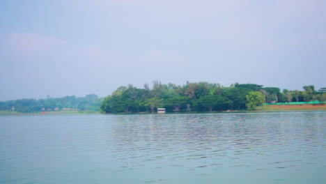 morning boat safari on kabini river with lush green forest and calm waters