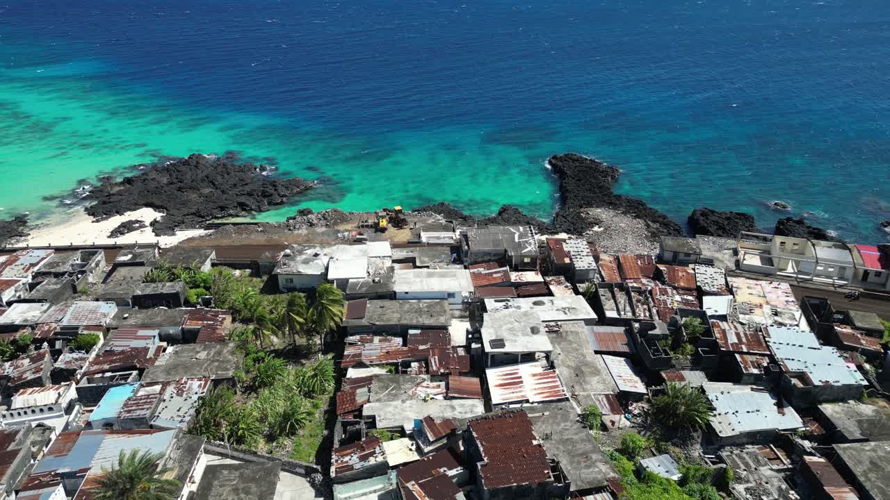 Aerial View Along Coastal Slum Neighborhood In Comoros, Poor Populated Urban Residential Area With Dense Houses