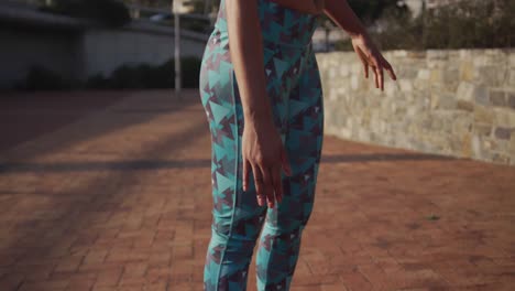 fit woman stretching in a park