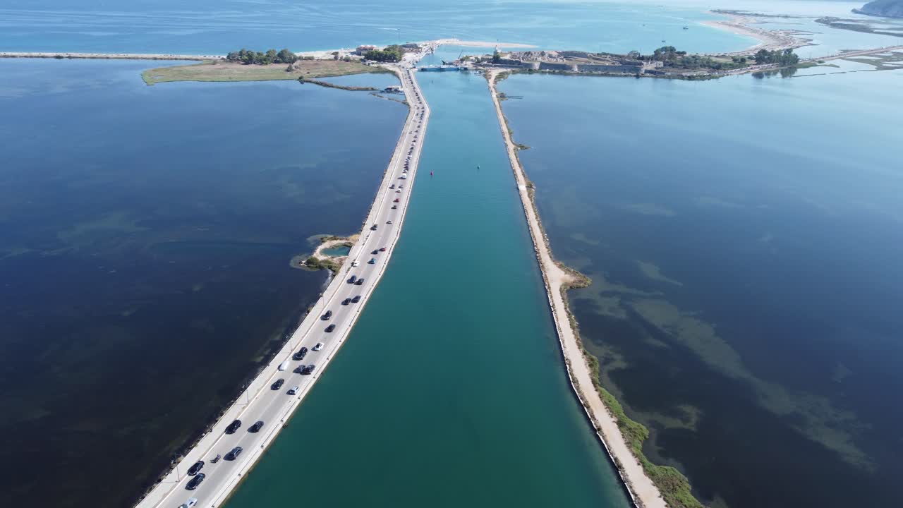 Aerial drone view video of Lefkada Canal a natural entrance to the island with swamp like landscape near castle of Agia Mavra, Ionian, Greece