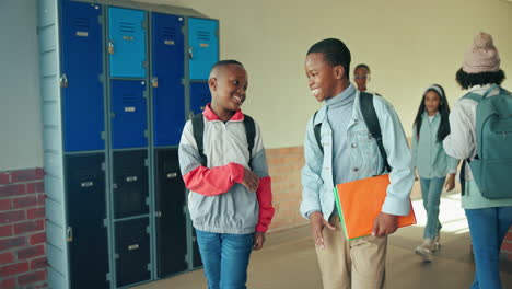students greeting each other in school corridor