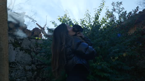 Lovely-Woman-Hugging-And-Kissing-Adorable-Miniature-Dachshund-Outdoor