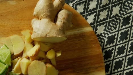 Sliced-ginger-and-lemon-on-a-chopping-board-4k-