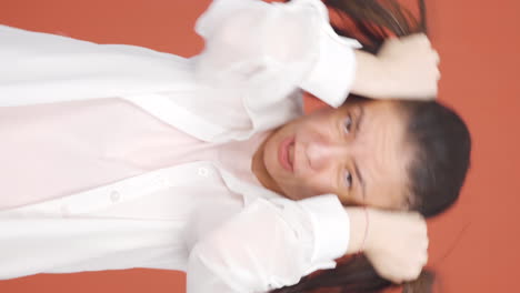 Vertical-video-of-Woman-having-a-nervous-breakdown-in-front-of-the-camera.