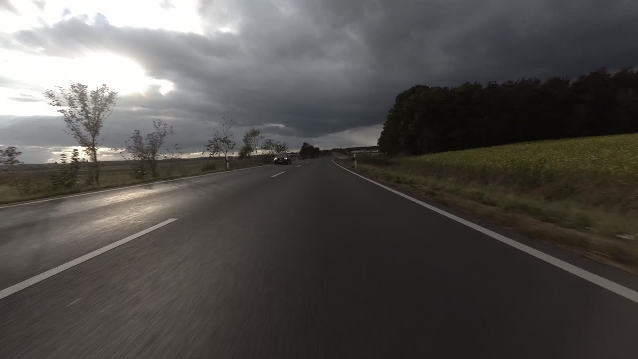 Drive on german highway from the car's point of view with rainy clouds, 4k