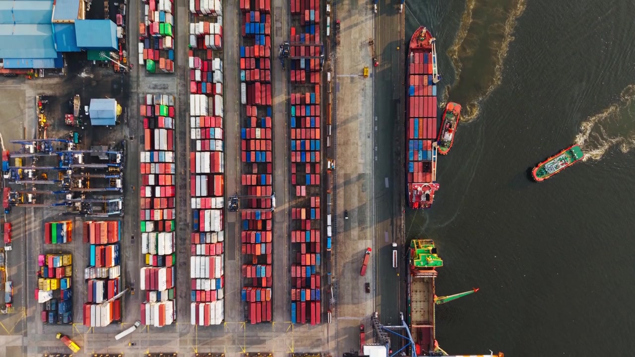 Cinematic drone shot captures cargo logistics powering Asian maritime commerce