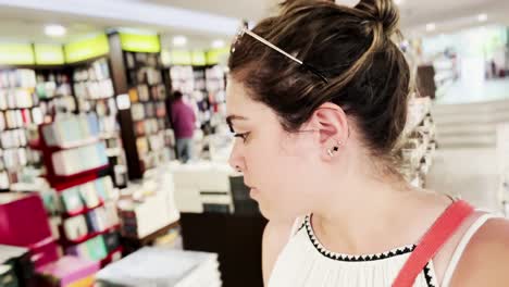 vlogger walking through bright athens bookstore, sharing experience