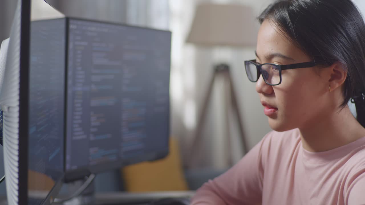Young woman studying or working on a computer.