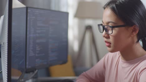 young woman studying or working on a computer.