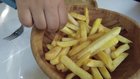 french fries in wooden bowl