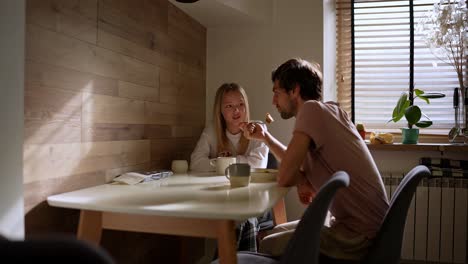 couple having breakfast in a cozy kitchen