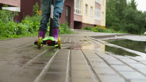 kid scooter cuts through rainsoaked air child on scooter embraces spontaneity of moment finding