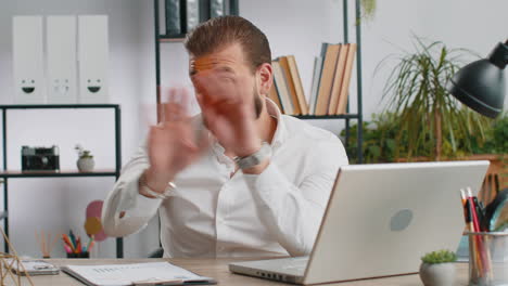 businessman working on laptop showing stop gestuge danger rejection warning crisis prohibition