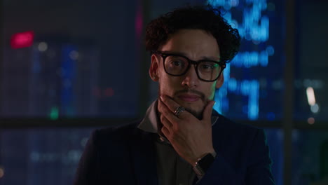 businessman in modern office at night