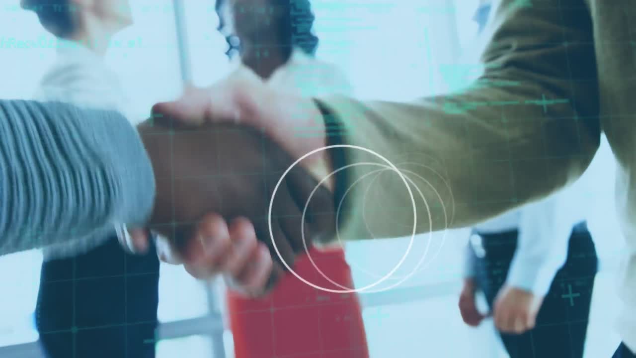 Animation of rotating rings and data processing over diverse business colleagues shaking hands