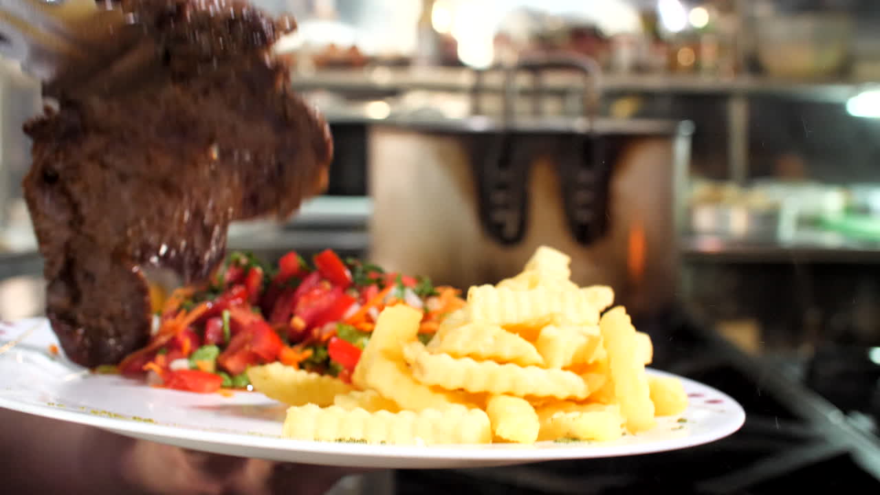 Preparing roast beef in restaurant, close-up, Mediterranean