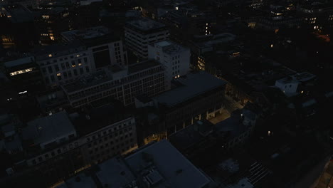 establishing drone shot over leeds city centre at night in low light