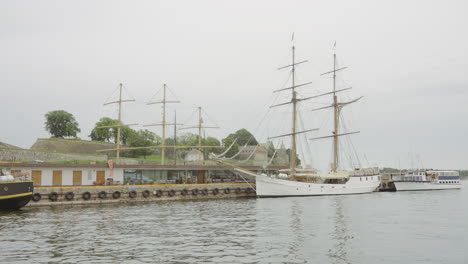 historical sailing ship docked in a harbor