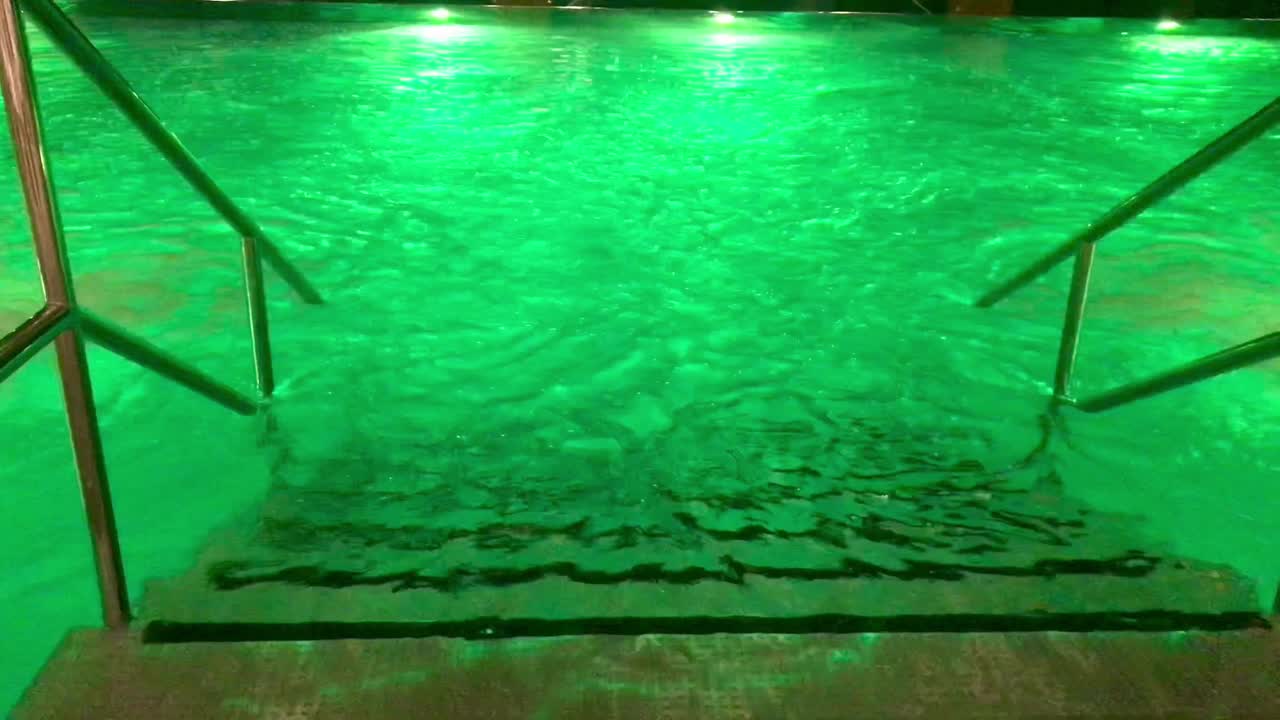 Top view angle of stainless steel poll ladder at wellness center with led lights