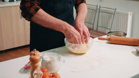 Kneading-bread-dough-in-a-glass-bowl