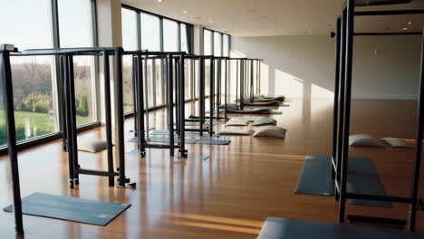 empty yoga and meditation studio with wooden floor