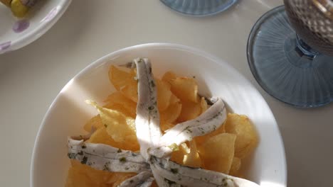 fresh tapas with gildas and boquerones on crispy chips, perfect for snacking