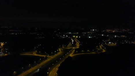 shot of highway at night with car passing by
