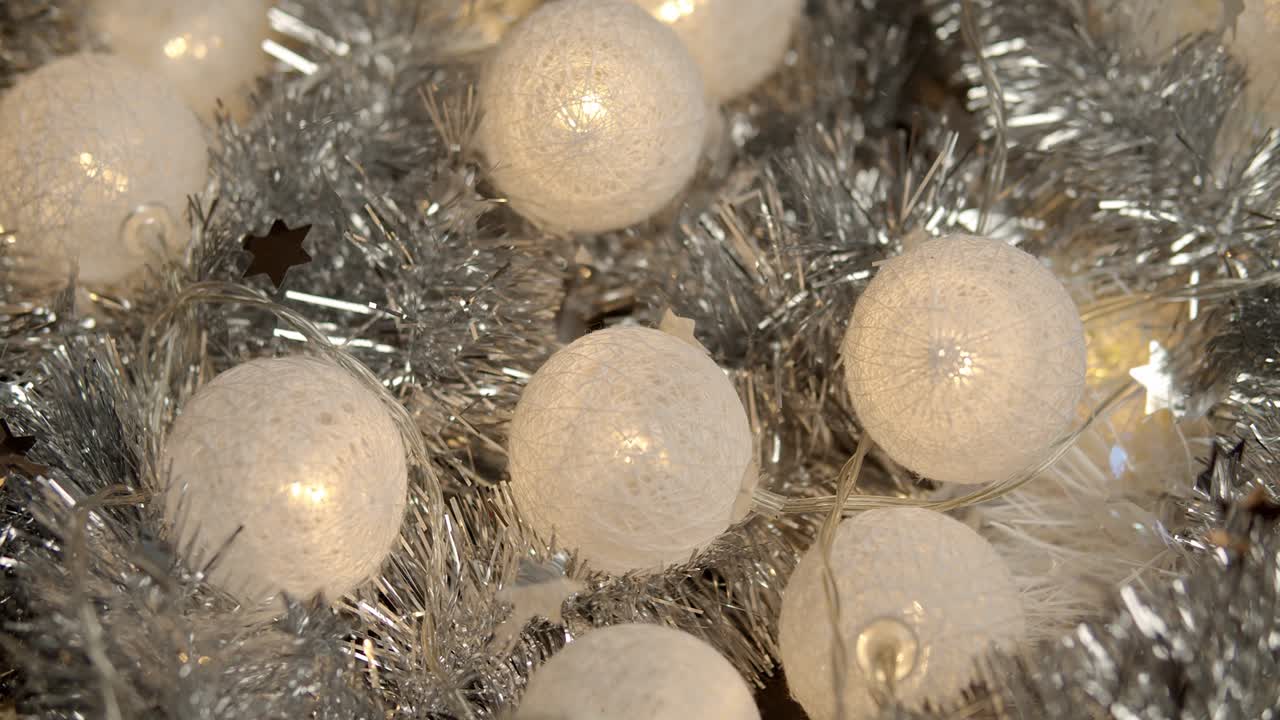 beautiful luminous baubles and a silver Christmas chain