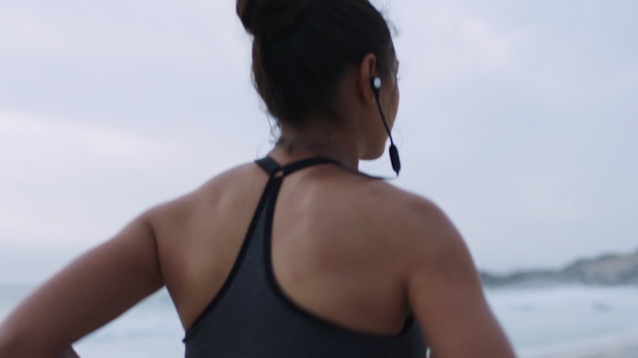 Beach running, woman and headphones of a runner by