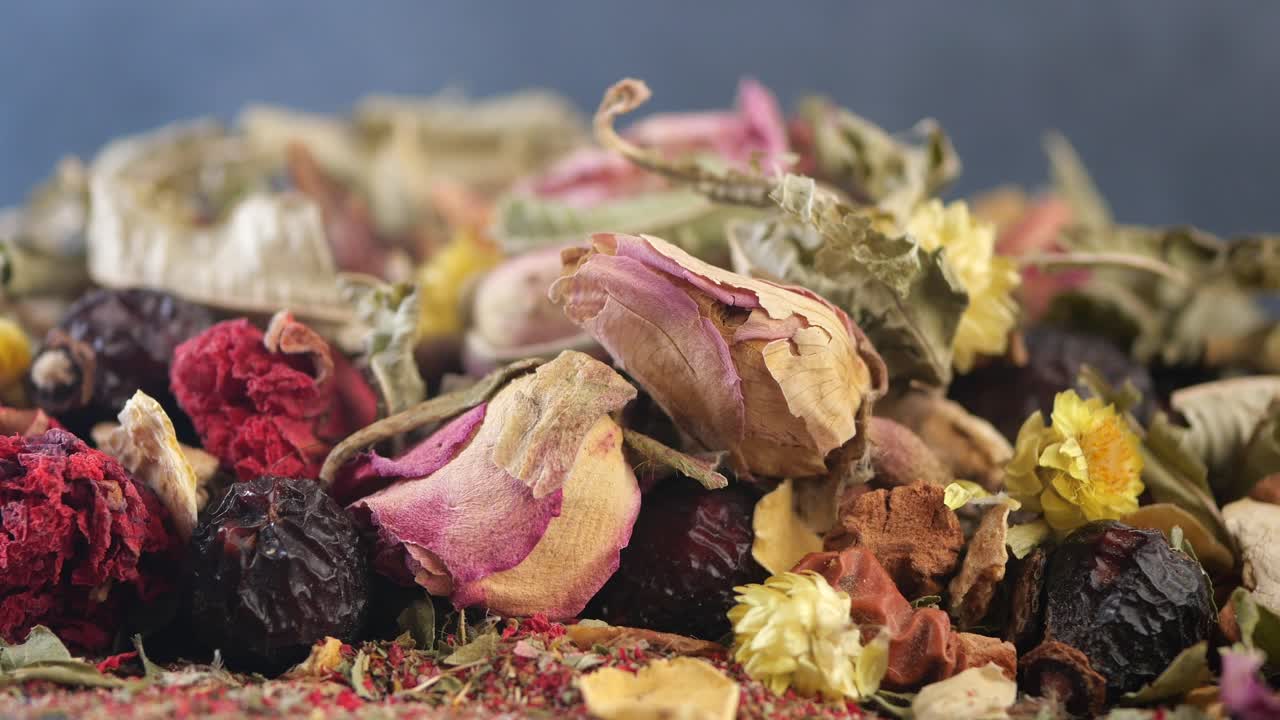 Close up of a variety of dried flowers and fruits, likely a herbal tea blend.