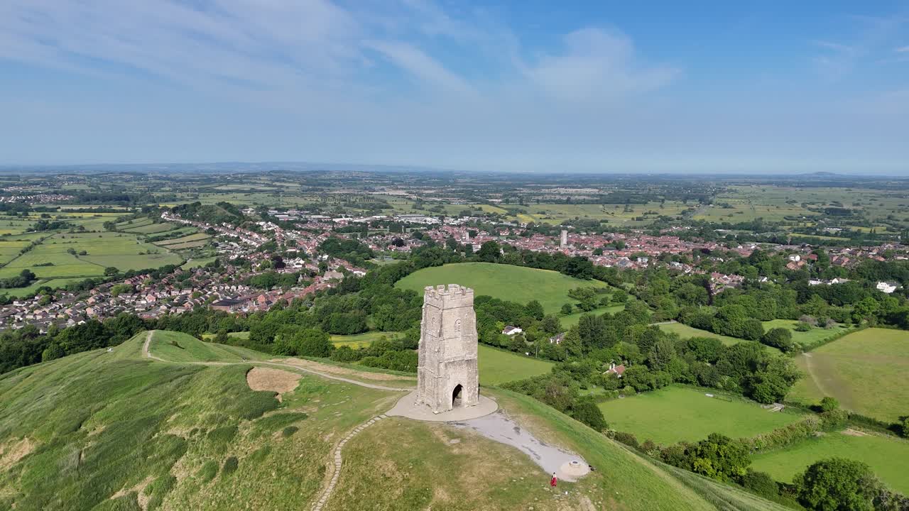 Drone push in Glastonbury Tor Somerset England Summer's day blue sky