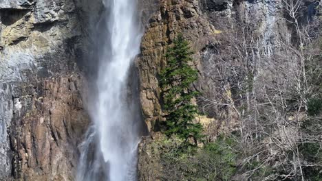 majestic seerenbach falls cascading against rocky cliffs in amden, betlis near walensee, switzerland