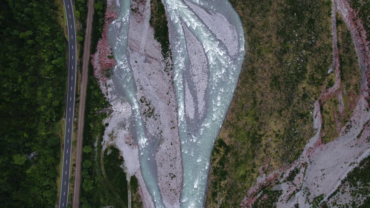 Top down drone shot over the Otira River Gorge, cloudy day in New Zealand