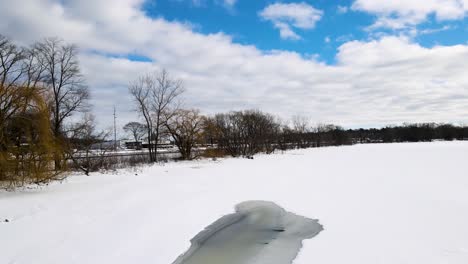 tracking across the shoreline of mona lake in winter
